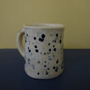 Speckled Mug in Blues on a Snow Background
